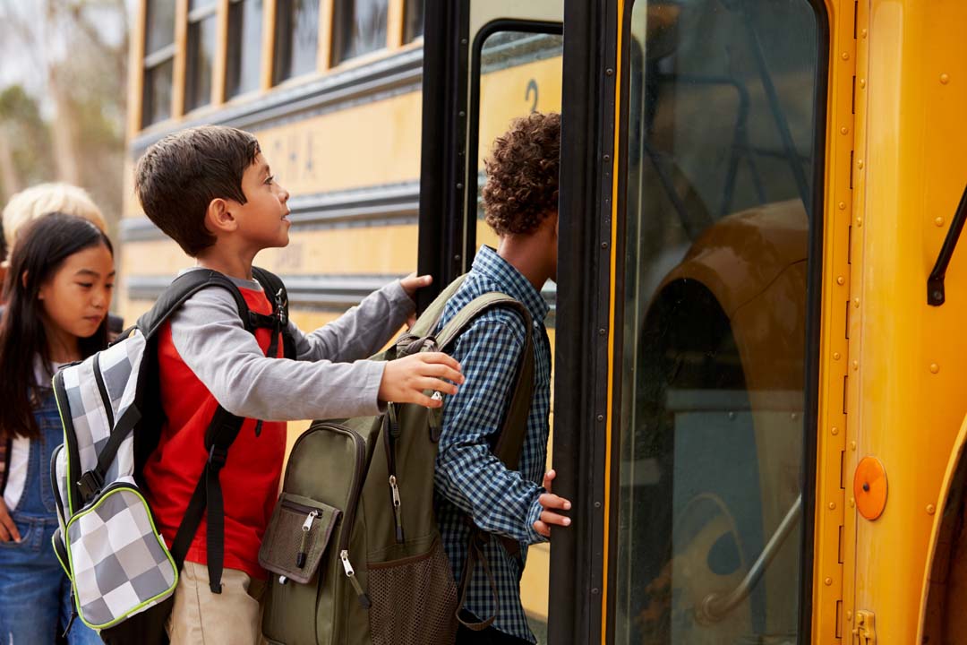 Students boarding a school bus