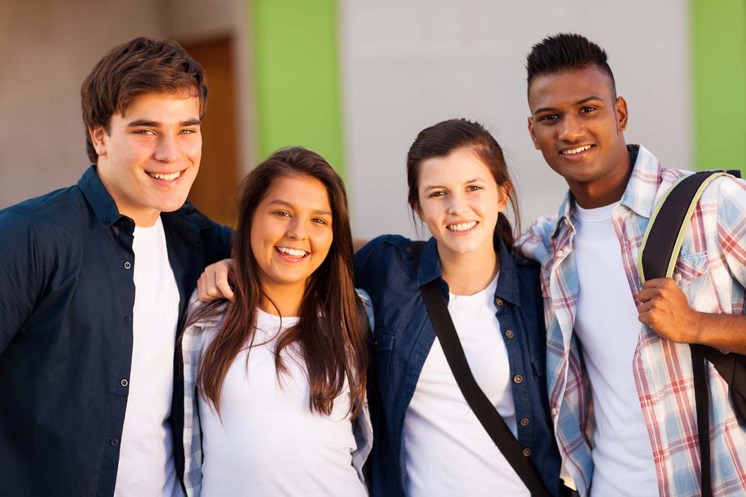 Four students standing