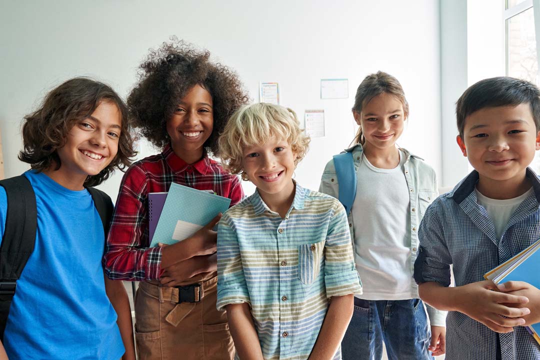 Group of students standing in a classroom