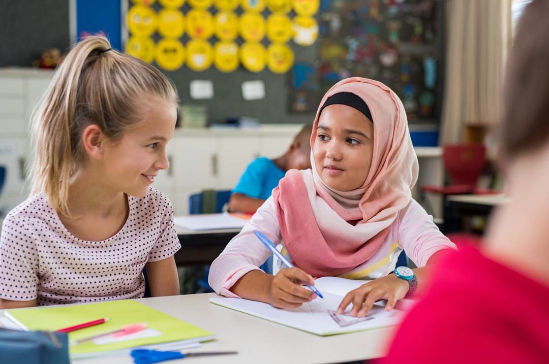 two students working in class