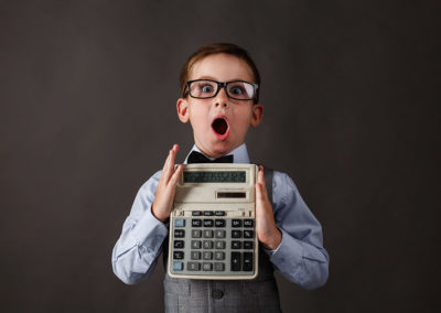 Child holding a calculator