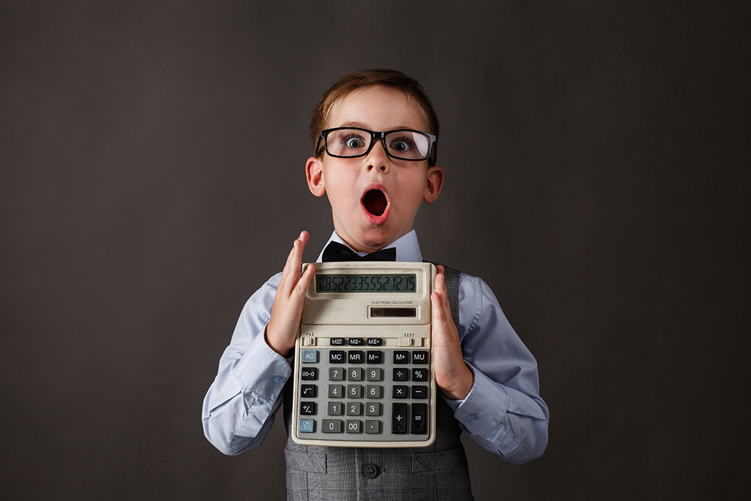 Child holding a calculator