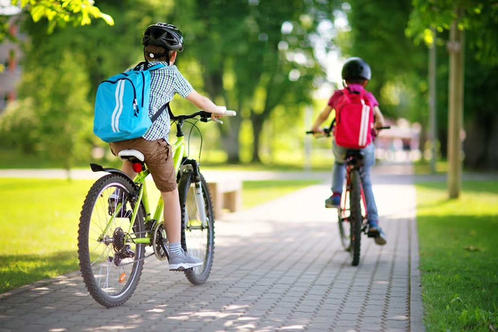 Two children riding bicycles