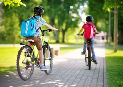 Two children riding bicycles
