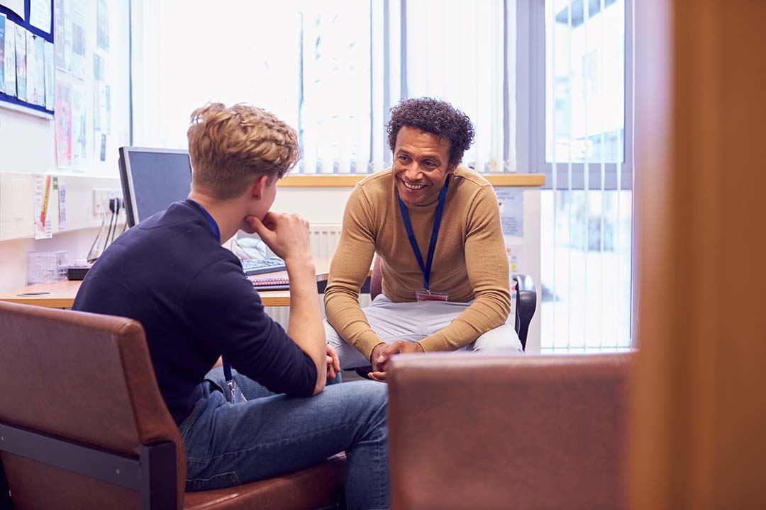 Counselor talking with student