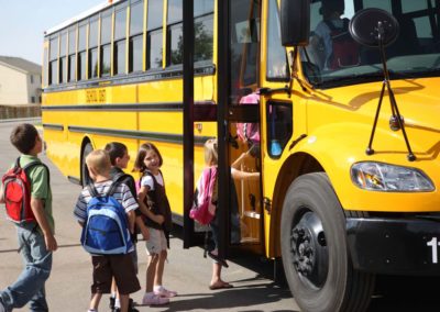 Children boarding a school bus
