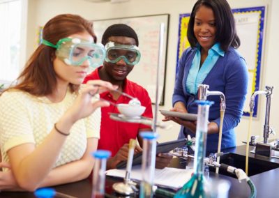 Students and a teacher in chemistry class