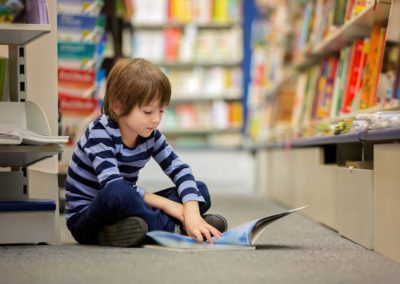 student reading in the library