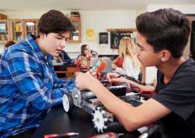 Two Pupils Building Robotic Vehicle In Science Lesson