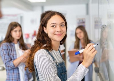 student holding a marker pen