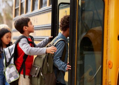 students boarding a school bus