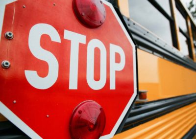 STOP sign attached to a school bus