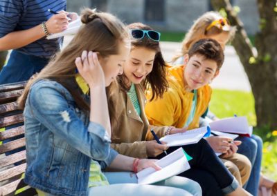 students sitting on a bench