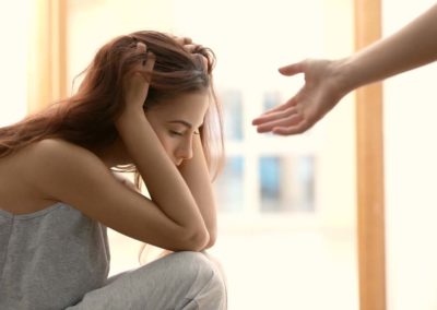 Outstretched had toward a student