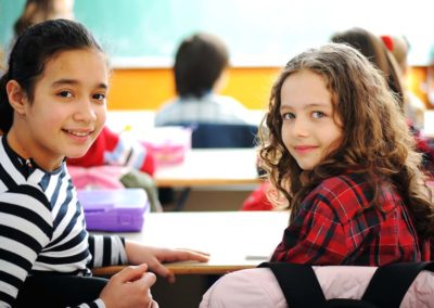 school children at classroom having education activities