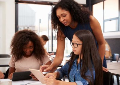 Teacher and students working in class